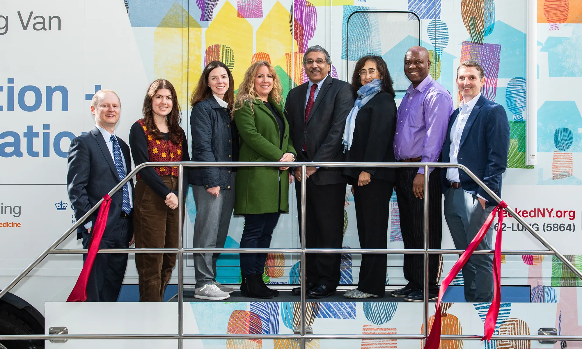 Members of Columbia’s Community Outreach and Engagement team and institutional leaders stand in front of the lung cancer screening van during the ribbon cutting.