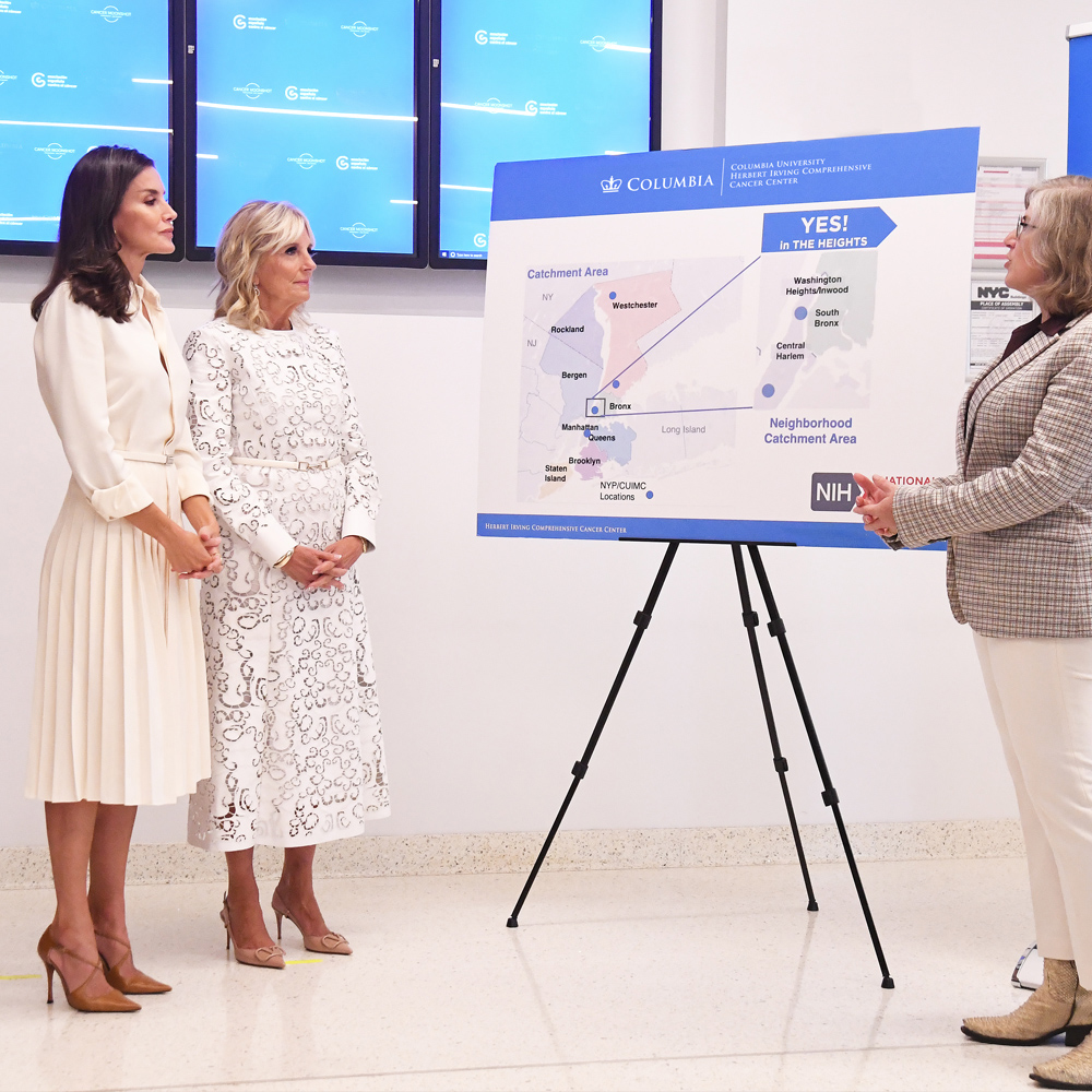 Dr. Biden and Queen Letizia listen intently to a presentation by HICCC researchers.